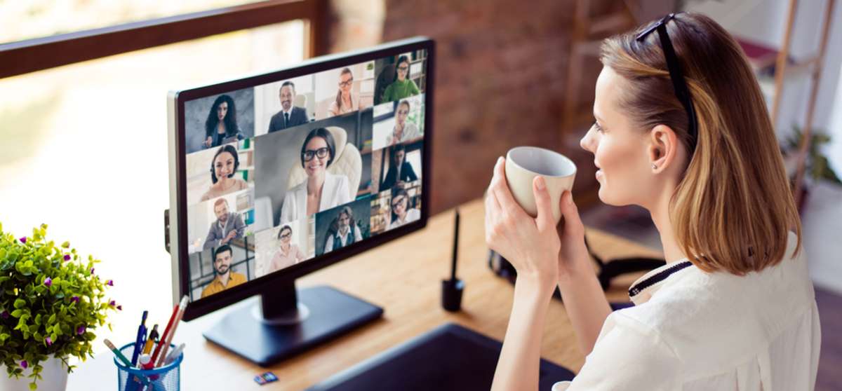 Back view photo of woman worker have webcam group conference with her coworkers on modern computer at home-1