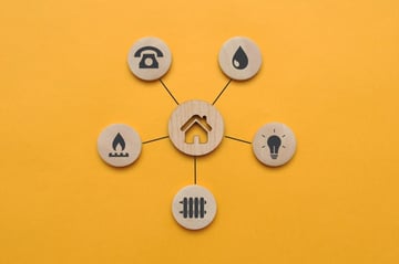 Home icon surrounded by icons for different utilities